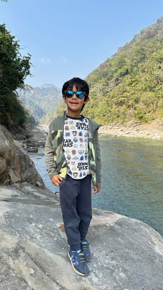 Kedaar by a river in the Himalayan foothills